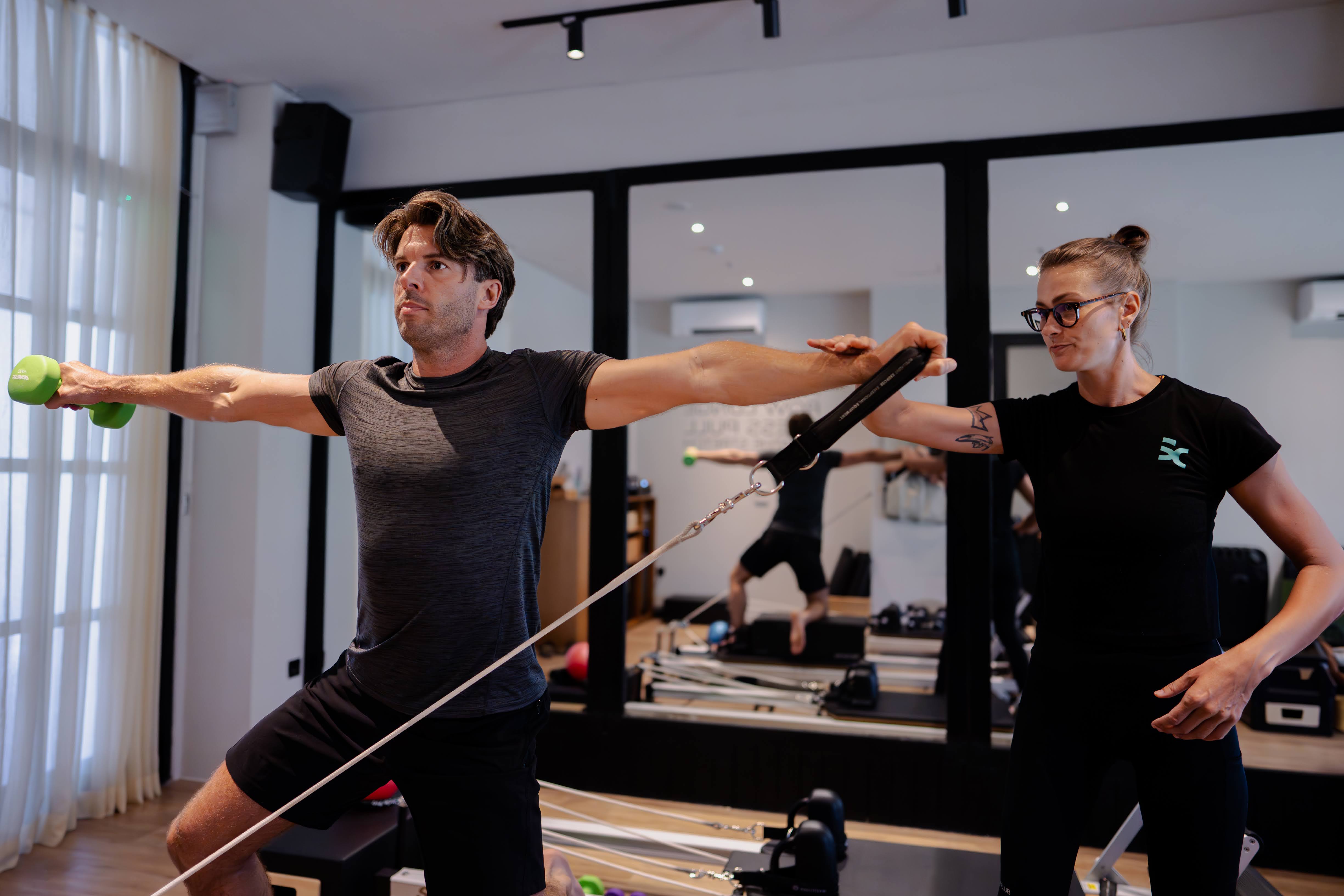 Reformer session with dumbbells